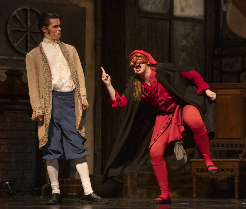 Theatre Production with two men on stage dressed in historical clothing